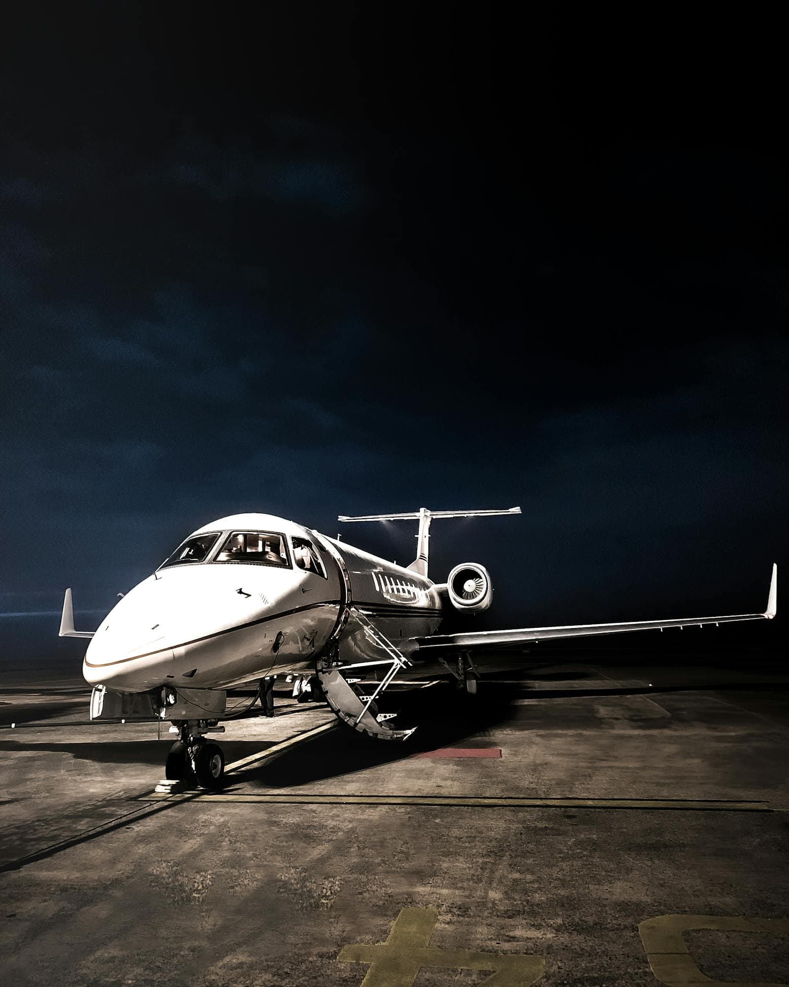 Private jet on the tarmac at dusk